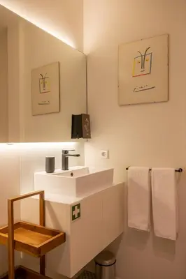 a bathroom with a sink and a mirror at The Cathedral's Terrace in Porto