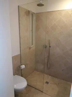 a bathroom with a shower with a toilet at ML Apartments Almada Living in Porto