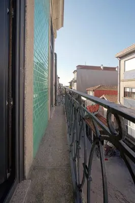 a bike parked next to a railing on a building at HM – Oporto Downtown Swimming Pool Apartment in Porto