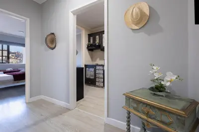a hallway leading to a living room with a table at MyRiverPlace N 5 River View Porto apartments in Vila Nova de Gaia