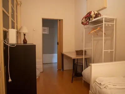 a small room with a desk and a room with a closet at Rustic Apartment in Poveiros in Porto