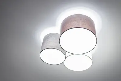 a light fixture with circles on a white wall at GuestReady - Subzero Design in Porto