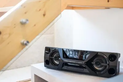 a speaker sitting on a counter next to some stairs at GuestReady - RiverWood Mezz in Porto