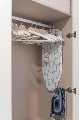 a closet with a shelf with a camera on it at GuestReady - Lazaro Studio in Porto