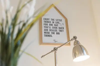 a picture frame hanging on a wall next to a lamp at GuestReady - Lazaro Studio in Porto