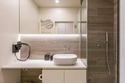 a bathroom with a sink and a shower at GuestReady - Lazaro Studio in Porto