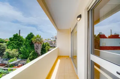 a balcony with a view of a city at Nomad's Easy Stay - 1BED Sunrise Cedofeita in Porto