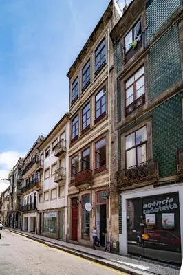 a row of buildings on a city street at Nomad's Easy Stay - 1BED Sunrise Cedofeita in Porto