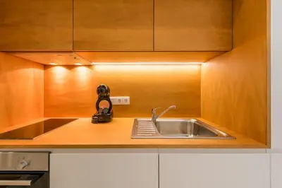 a kitchen with a sink and a camera on the counter at Bright Studio in the Heart of Porto by Great&Cosy in Porto