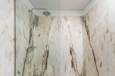 a shower with a glass door in a bathroom at Bright Studio in the Heart of Porto by Great&Cosy in Porto