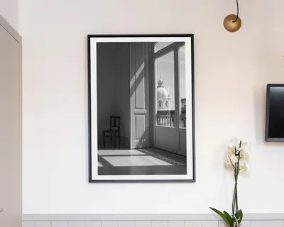 a picture of a mirror on a wall at CASA JOY Cathedral apartment in Porto
