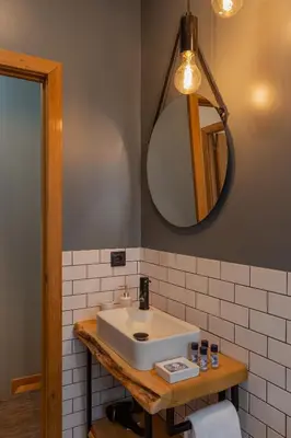 a bathroom with a sink and a mirror at ORM- Fontainhas 01 & 02 Apartments in Porto