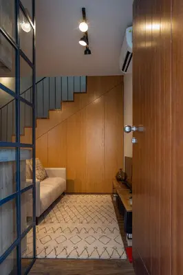 a living room with a bed and a stair case at ORM- Fontainhas 01 & 02 Apartments in Porto