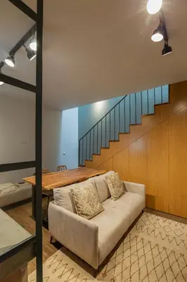 a living room with a couch and a table at ORM- Fontainhas 01 & 02 Apartments in Porto