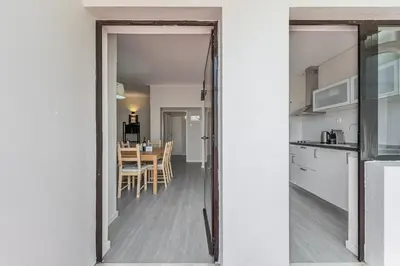 a view of a kitchen and dining room from a door at GuestReady - Music Area in Porto