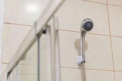 a shower head is attached to a wall at GuestReady - Music Area in Porto