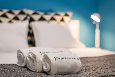 a bed with a towel with an elephant on it at GuestReady - Miragaia Historical Sight in Porto