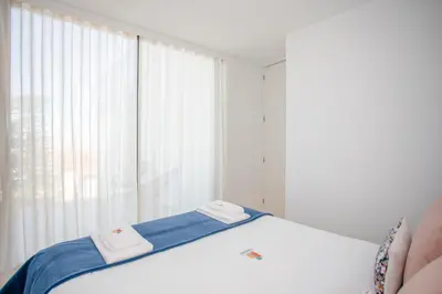 a bedroom with a bed with two towels on it at Liiiving in Porto - City View Apartments in Porto