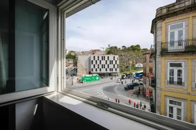 a window with a view of a city street at Impar Studios Deluxe in Porto