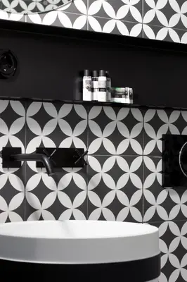 a bathroom with a sink and a black and white wall at HM - Infante Riverside Apartment N in Porto