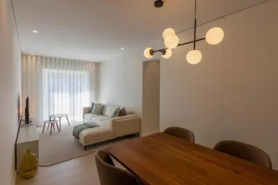 a living room with a table and a couch at ORM Antero Apartment in Porto