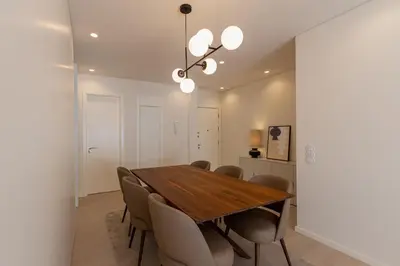 a dining room with a wooden table and chairs at ORM Antero Apartment in Porto
