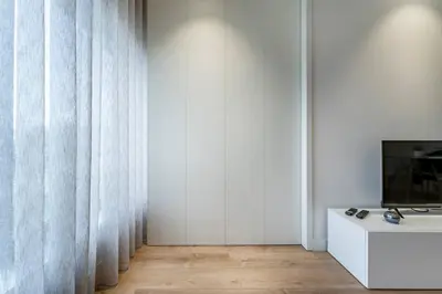 a living room with a couch and a mirror at Antas Park Flat With Pool in Porto