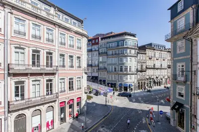 a view of a city street with tall buildings at Mouzinho Darling 1BR w/ AC in City Center by LovelyStay in Porto