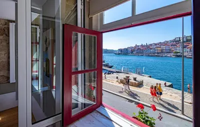 a window view of a beach from a house at NorteSoul Porto à Vista in Vila Nova de Gaia
