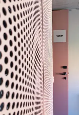 a hallway with a wall with a metal wall at Oporto CoLiving Monte Ramalde in Porto