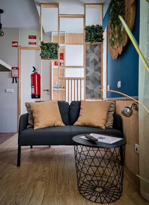 a living room with a couch and a table at Cantinho do Chico in Vila Nova de Gaia