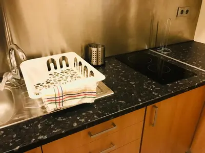 a kitchen counter with a sink and a towel at Congregados Apartment in Porto