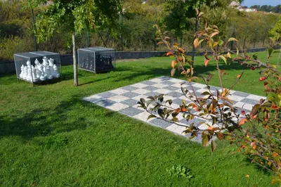 a picnic table in the grass with two water bottles at Portoo Blue Apartments - Douro in Vila Nova de Gaia