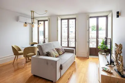 a living room with a couch and a table at Douro Golden Studio in Porto