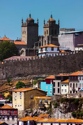 a city with two towers on a hill with buildings at Douro Golden Studio in Porto