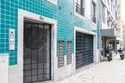 a building with blue tile on the side of a street at The Beautiful Ones Studio in Porto