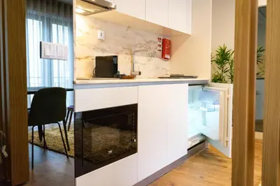 a kitchen with a sink and a counter at The Beautiful Ones Studio in Porto