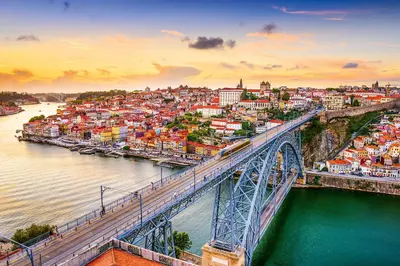 a bridge over a river with a city at The Beautiful Ones Studio in Porto