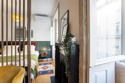 a bedroom with a bed and a window at Mouzinho Darling Studio w/ AC in City Center by LovelyStay in Porto
