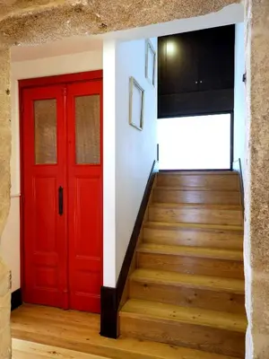 a red door and stairs in a house at Framer's House - Authentic Downtown in Porto