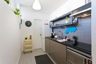 a small kitchen with a sink and a counter at Sunny Oporto, Trindade Balcony in Porto