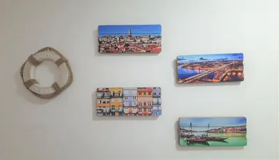 a group of pictures on a white wall at Sunny Oporto, Douro Apartments in Porto