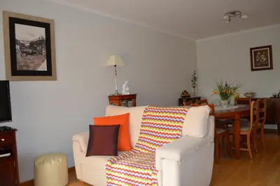 a living room with a white couch and a table at Musical View in Porto
