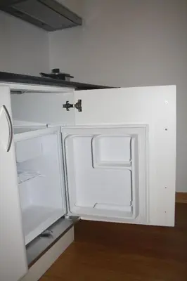 an empty refrigerator with its door open in a room at Be In Oporto in Porto