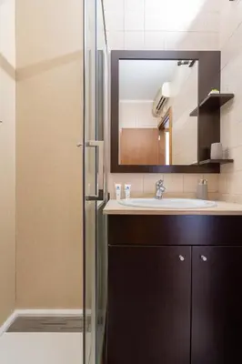 a bathroom with a sink and a mirror at Host Wise - Urban Stylish Flat - Ace Location in Porto