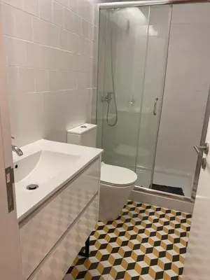 a bathroom with a shower and a sink and a toilet at Quiet Apartment with Terrace in the Heart of Porto by Great&Cosy in Porto