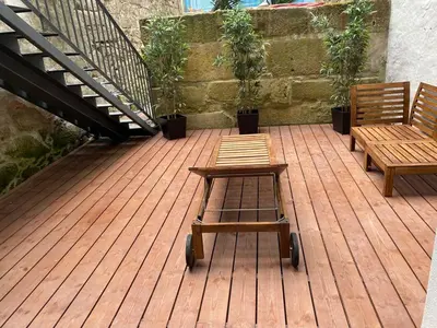 two benches on a wooden deck with a staircase at Quiet Apartment with Terrace in the Heart of Porto by Great&Cosy in Porto