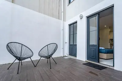 a group of people standing outside a building with umbrellas at Oporto Wine Cellars Flat With Terrace in Vila Nova de Gaia