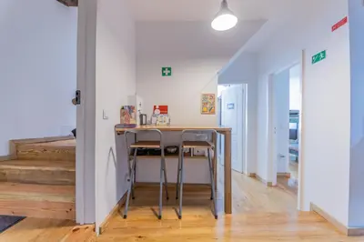 a kitchen with a table and chairs in a room at Douro View House Ribeira in Porto
