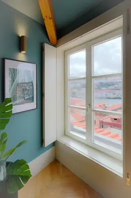 an empty room with a window with a view at HM - Infante Riverside Apartment R in Porto